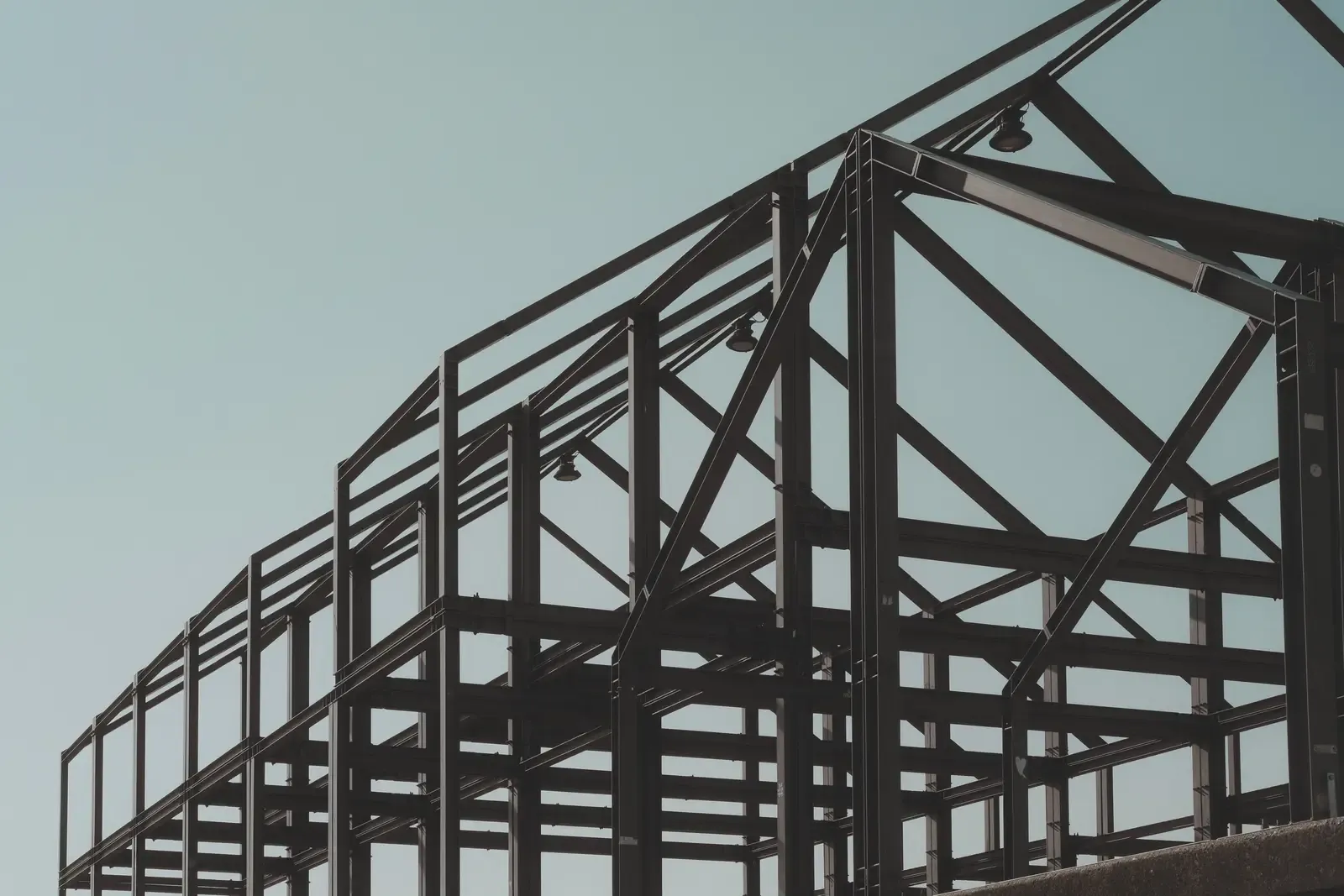 A steel building frame going up in the Texas Hill Country